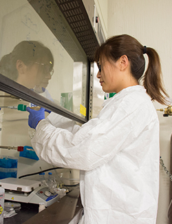 female researcher in Yong Wang's research lab