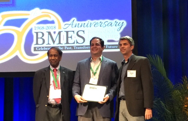 Keefe Manning, professor of biomedical engineering, (center) receives the Most Cited Article Award from Ajit Yoganathan, editor of Cardiovascular Engineering and Technology, (left) and Steven Day, chair, biomedical engineering, Rochester Institute of Technology.