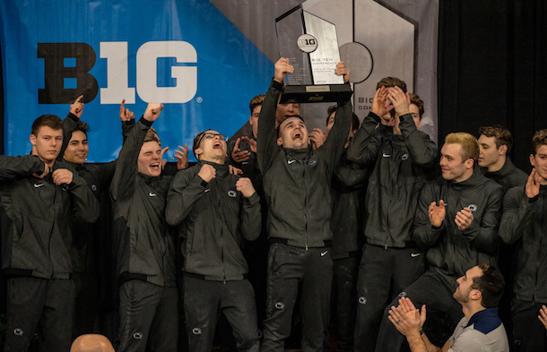 Biomedical engineering 2019 spring commencement student marshal Noah Roberson (center, holding trophy) celebrates the 2019 Big Ten Men's Gymnastics Championship with his teammates. 