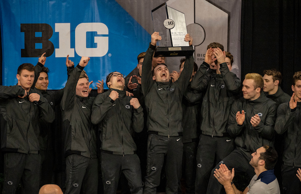 Biomedical engineering 2019 spring commencement student marshal Noah Roberson (center, holding trophy) celebrates the 2019 Big Ten Men's Gymnastics Championship with his teammates.