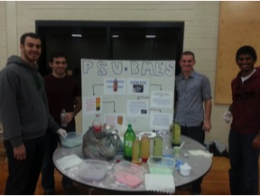 BMES students around table with STEM training materials