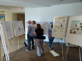 Attendees looking at posters during BPS