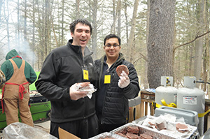 Several students getting food to eat.