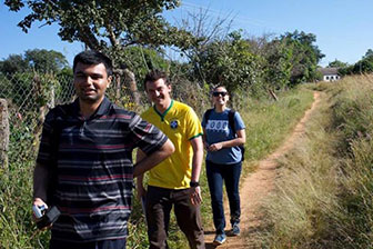Several members of the Zambia team hiking along trail